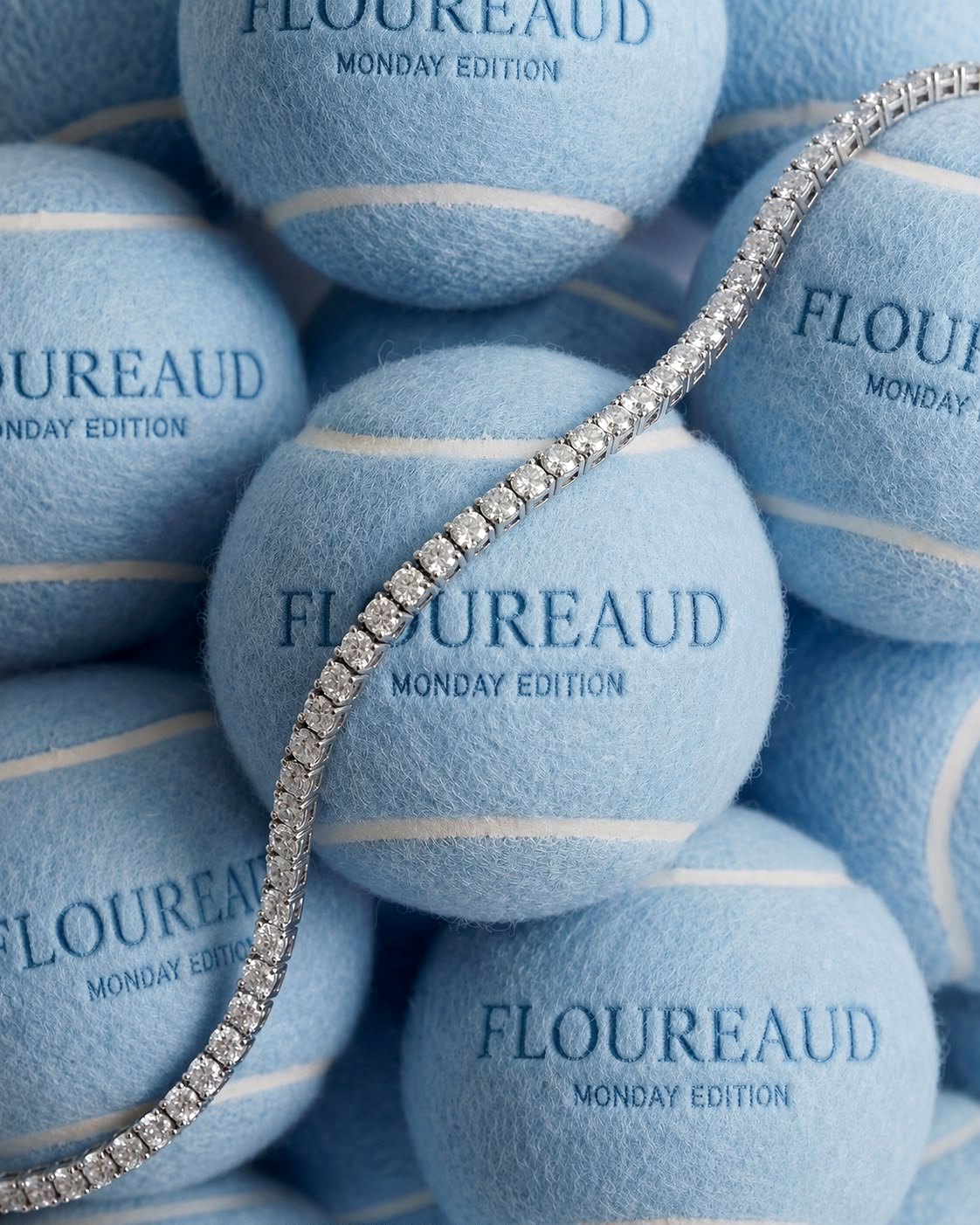Monday Edition — the Riviera resting on blue felt tennis balls embroidered Floureaud